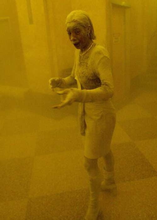 This September 11, 2001 file photo shows Marcy Borders covered in dust as she takes refuge in an office building after one of the World Trade Center towers collapsed in New York. Borders was caught outside on the street as the cloud of smoke and dust enveloped the area. The bank worker who survived World Trade Center terror attack died at 42 after year-long battle with cancer on August 24, 2015. Pic/AFP