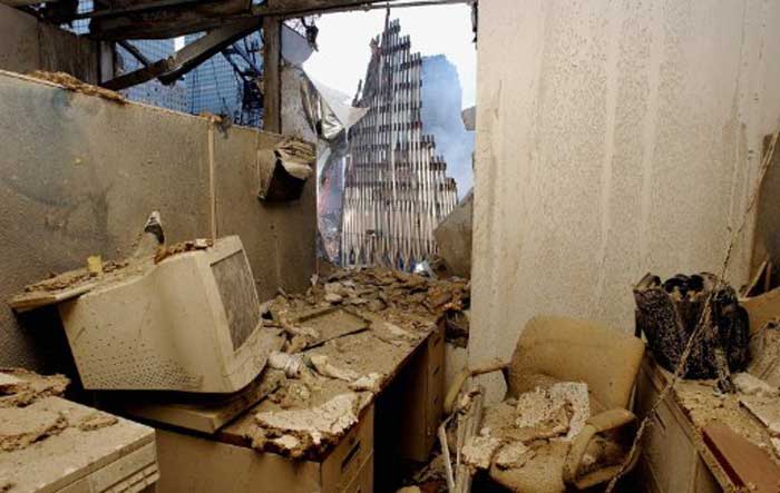 An office filled with dust and damage has a view of the wreckage of the World Trade Center on September 25, 2001 in New York. Search and rescue efforts continue in the aftermath of the 11 September terrorist attack. Pic/AFP