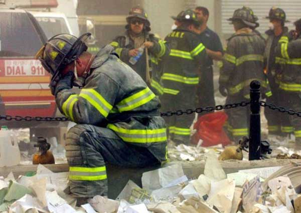 A firefighter breaks down after the World Trade Center buildings collapsed on September 11, 2001 after two hijacked airplanes slammed into the twin towers in a terrorist attack. Mario Tama/Getty Images/AFP