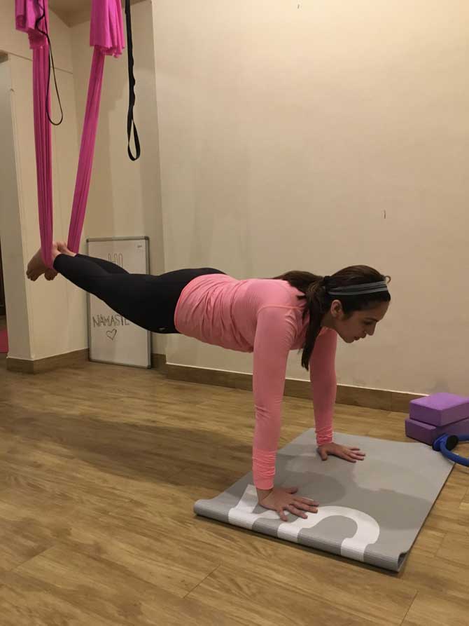 Anshuka Parwani captioned this photo: Huma Qureshi performs a Fly-Fit yoga pose at Anshuka Parwani's yoga studio, 'Anshuka yoga'