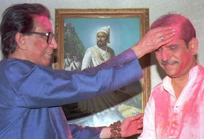 Thackeray places powder on the forehead of the new Maharashtra Chief Minister, Manohar Joshi (R), March 17, 1995 during Holi celebrations at Thackeray's residence
