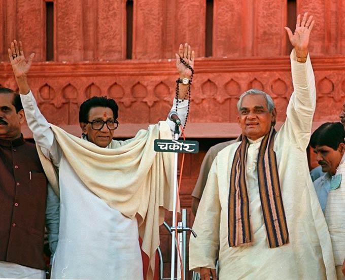 Atal Behari Vajpayee (R) along with the alliance Shiv Sena leader Bal Thackeray waves to crowds on February 25, 1998. Vajpayee vowed that if he was made the next Indian prime minister he would take back Pakistan administered Kashmir at the election rally on the Shavaji park ground in central Mumbai