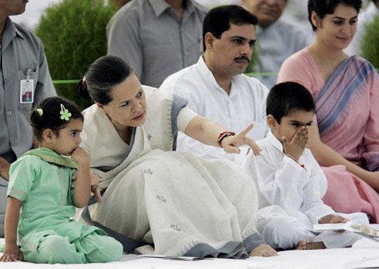 Sonia Gandhi seen with her grandchildren Miraya (L) and Raihan along with her daughter Priyanka Gandhi Vadra (R) and son-in-law Robert Vadra (2nd-R), during a memorial ceremony for her late husband Rajiv Gandhi, on the 61st anniversary of his birth in New Delhi on 20 August 2005.