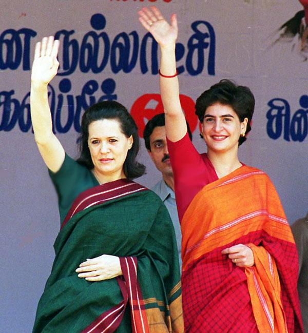 Sonia Gandhi (L) and daughter Priyanka wave at crowds at Sonia's first election campaign rally near the site of Rajiv Gandhi's assassination in Sripurumbudur on11 January 1998.