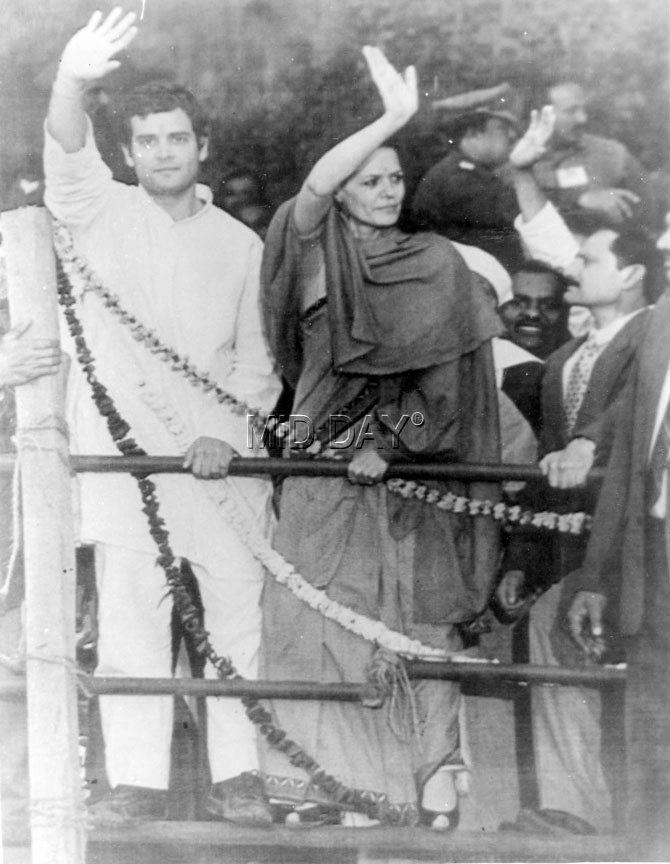 Perched on the fence Sonia Gandhi and Rahul Gandhi wave to the crowd at an election rally in Meerut