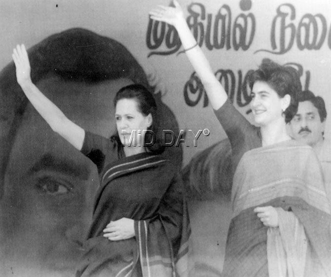 Sonia Gandhi and her daughter Priyanka Gandhi wave at the large gathering in Sriperumbadur. Pic/PTI