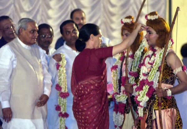 Congress president Sonia Gandhi with then Indian Prime Minister Atal Behari Vajpayee (L) during a function celebrating the last day of Dusshera festival in New Delhi on 15 October 2002.
