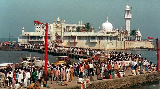People line up to enter the Haji Ali Mosque off south Mumbai to celebrate Eid El-Fitr
