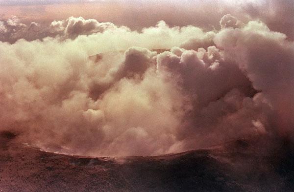 The crater of the volcano Nevado Del Ruiz smolders on 17 November 1985, 3 days after its eruption which destroyed the mountain town of Armero in Colombia. Over 23,000 people were confirmed dead.