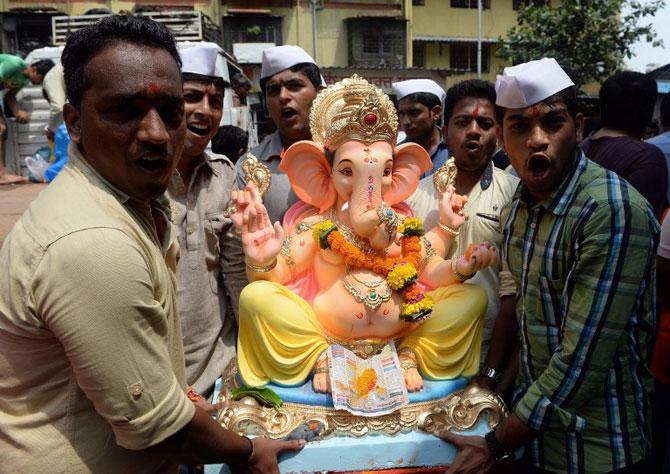 Devotees carry an idol of Lord Ganesha for Ganesh Chaturthi. Pic/ AFP Devotees carry an idol of Lord Ganesha for Ganesh Chaturthi. Pic/ AFP