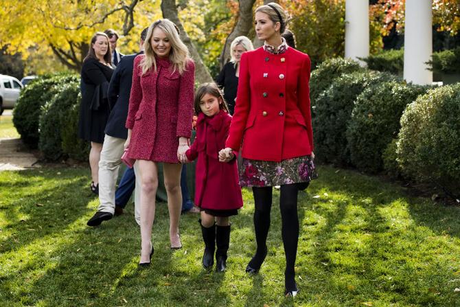 Ivanka Trump holds her daughter Arabella Kushner's hand as she walk with sister Tiffany Trump (L) after viewing the pardoned Thanksgiving turkey Drumstick in the Rose Garden of the White House in Washington, DC, on November 21, 2017