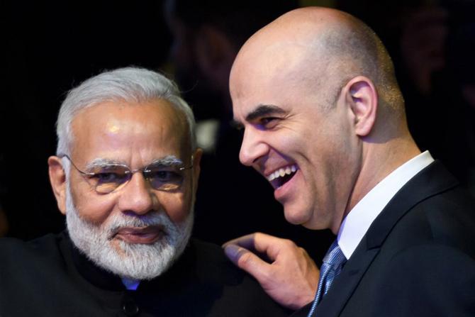 Narendra Modi (L) listens to Swiss President Alain Berset on the opening day of the World Economic Forum (WEF) 2018 annual meeting, on January 23, 2018 in Davos, eastern Switzerland. Pic/AFP Narendra Modi (L) listens to Swiss President Alain Berset on the opening day of the World Economic Forum (WEF) 2018 annual meeting, on January 23, 2018 in Davos, eastern Switzerland. Pic/AFP