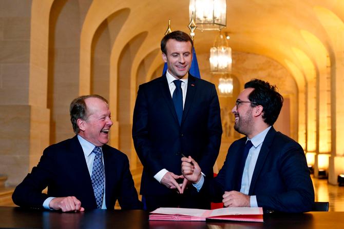 Former CEO of Cisco Systems, John Chambers (L), France's President Emmanuel Macron (C), and French Minister of State for the Digital Sector Mounir Mahjoubi, attend a signing ceremony to name Chambers as the representative of the French Tech, during the 'Choose France' summit, at the Chateau de Versailles, outside Paris on Januray 22, 2018. Pic/AFP Former CEO of Cisco Systems, John Chambers (L), France's President Emmanuel Macron (C), and French Minister of State for the Digital Sector Mounir Mahjoubi, attend a signing ceremony to name Chambers as the representative of the French Tech, during the 'Choose France' summit, at the Chateau de Versailles, outside Paris on Januray 22, 2018. Pic/AFP
