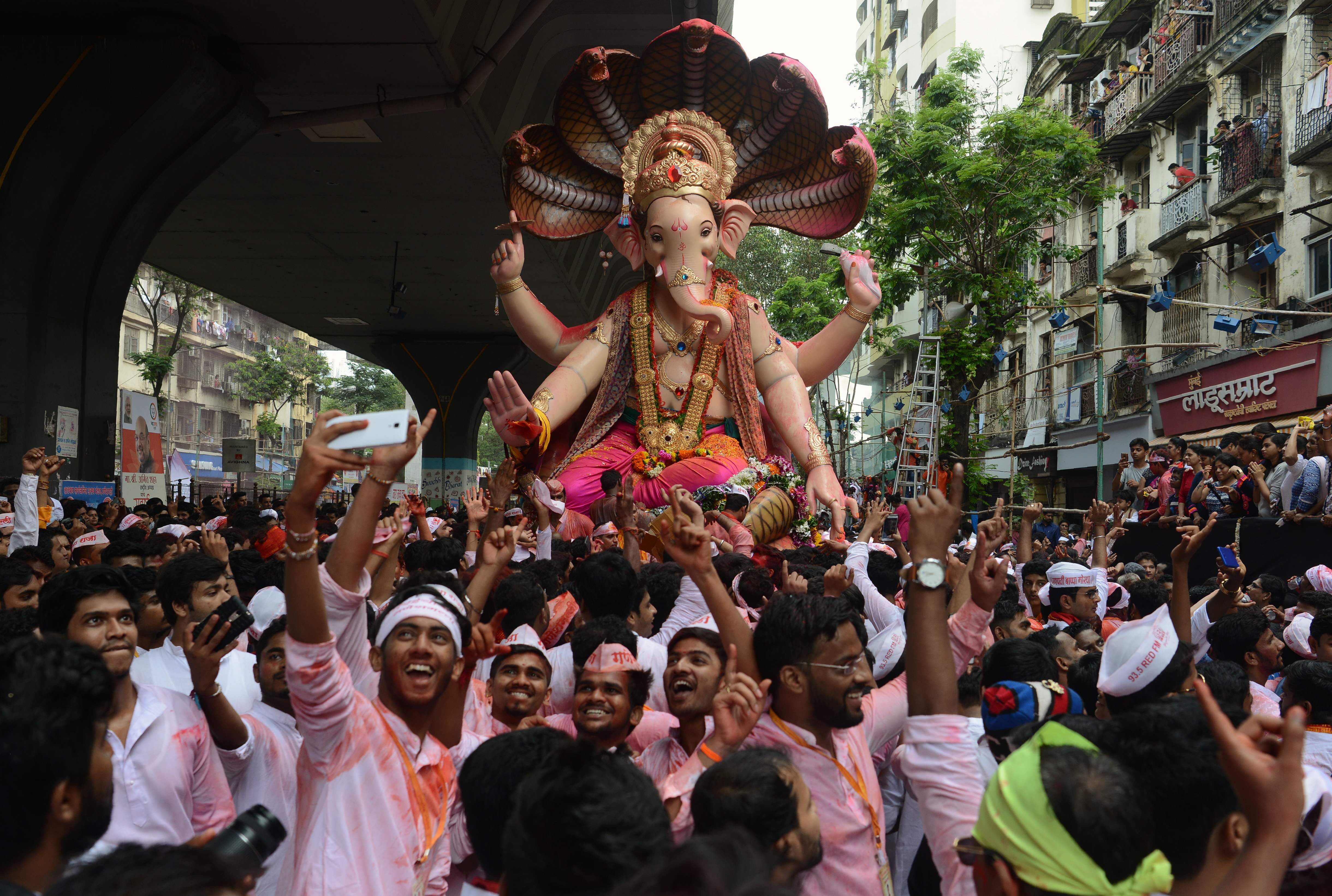 A group of Ganesh Visarjan revellers posing for a selfie