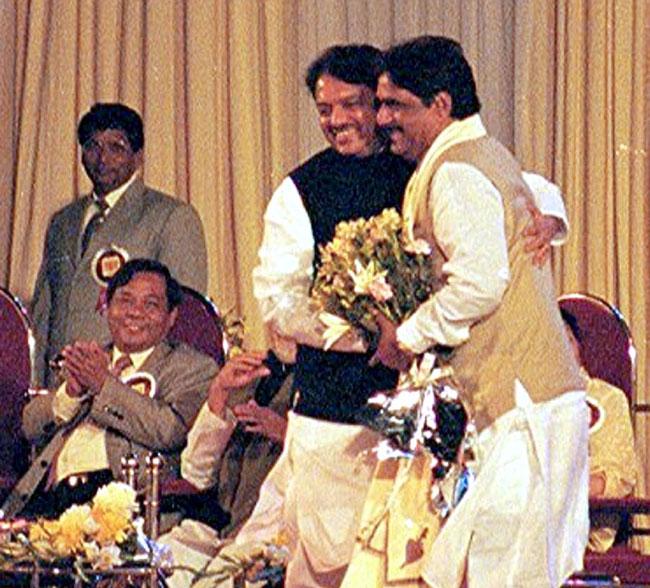 Gopinath Munde's tenure as Home Minister became famous for the free hand he gave the Mumbai and state police to eliminate mafia dons and gangsters in what came to be known as the dreaded 'encounter killings' or staged shootouts Gopinath Munde greets Vilasrao Deshmukh during one of his birthdays. All photos/mid-day archives 