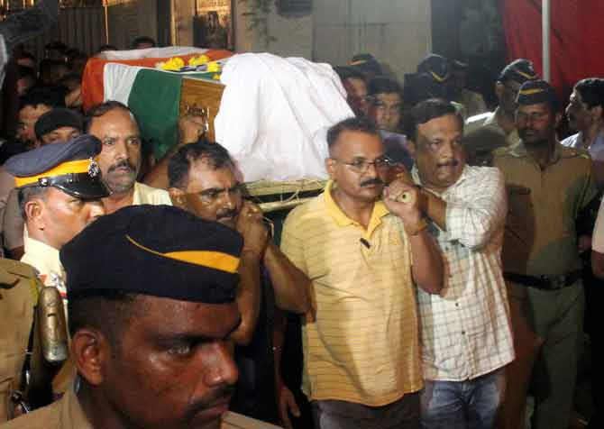 Maharashtra IPS officer Himanshu Roy was cremated with full state honours. His flower bedecked body draped in the national Tricolor was taken in an ambulance from his Nariman Point home to the Chandanwadi Crematorium at Charni Road around 9.30 p.m. A large number of police personnel, former and serving IPS and IAS officers, besides political leaders, including Union Minister Ramdas Athawale, were present for Roy's final journey. Pic/ Bipin Kokate