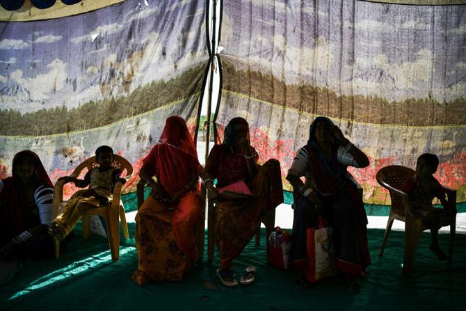 Patients and their relatives wait prior to their treatment on the