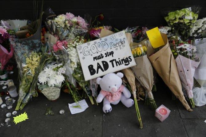 Tributes to the victims and the missing from the Grenfell Tower block fire disaster are seen close to the scene in west London, on June 18, 2017.  The presumed death toll from the London tower block inferno jumped to 58 on Saturday as embattled Prime Minister Theresa May, accused of misreading the growing anger over the tragedy, pledged action after meeting survivors desperately seeking answers. Pic/AFP