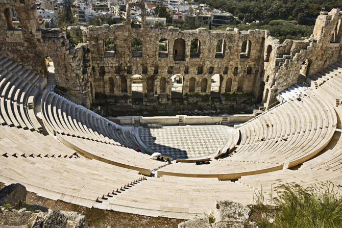 The tyrant Peisistratos introduced the annual Festival of the Great Dionysia during the 6th century BC, and held it in the world's first theatre - Theatre of Dionysus on the south slope of the Acropolis. It was composed of wooden seats surrounding a circular orchestra of beaten earth with dramatic and musical competitions held in full fervour. The theatre has been reconstructed over the time. The tyrant Peisistratos introduced the annual Festival of the Great Dionysia during the 6th century BC, and held it in the world's first theatre - Theatre of Dionysus on the south slope of the Acropolis. It was composed of wooden seats surrounding a circular orchestra of beaten earth with dramatic and musical competitions held in full fervour. The theatre has been reconstructed over the time.