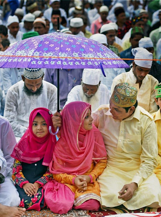 Muslims offering namaz outside the Bandra railway station on the occasion of Eid-ul-Fitr in Mumbai on Monday. Pic/PTI