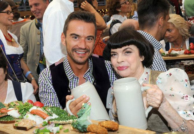 French singer Mireille Mathieu poses with German folk musician Florian Silbereisen at the Oktoberfest beer festival. Pic/AFP