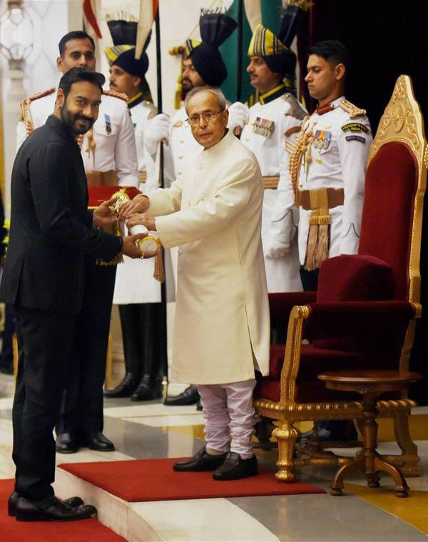 President Pranab Mukherjee presents the Padma Shri to Bollywood actor Ajay Devgn. Pic/PTI