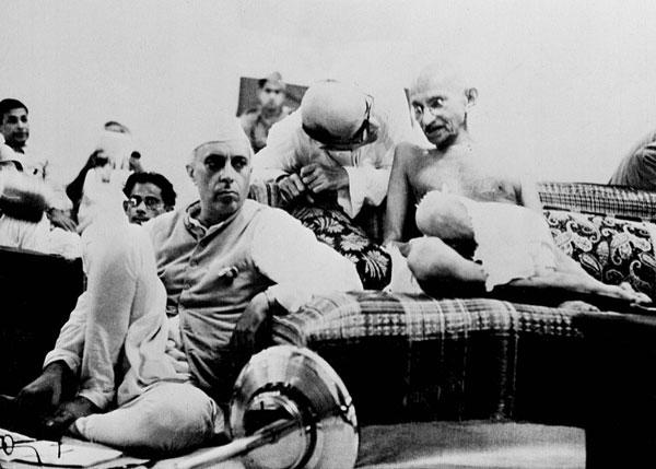 Mahatma Gandhi (R) sits with Jawaharlal Nehru, during a Congress Party meeting in Mumbai (then Bombay), August 9, 1942.