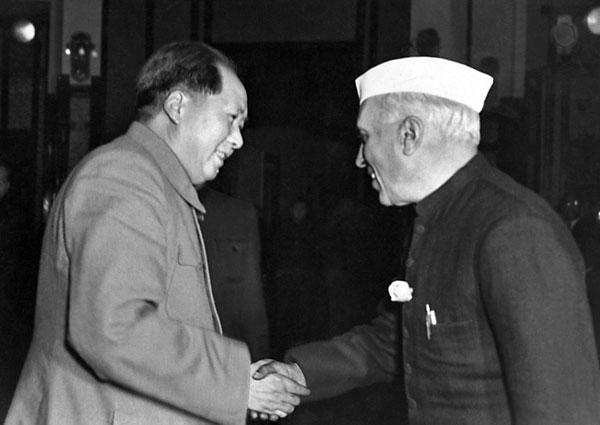 Indian prime minister Pandit Jawaharlal Nehru, in official visit in China, shakes hand with Chinese president Mao Zedong, October 12, 1954 in Beijing.