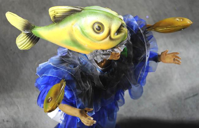 Fishy! A reveler wears a fish costume during carnival parade at the Sambadrome
