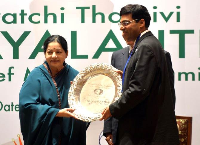 Jayalalithaa practiced politics on her own terms and was one of the two poles in the state for nearly 30 years fighting the DMK headed by redoubtable M Karunanidhi Chess legend Vishwanathan Anand (R) receives a trophy from the Chief Minister of Tamil Nadu, J. Jayalalithaa (L) during a presentation ceremony in Chennai on November 25, 2013
