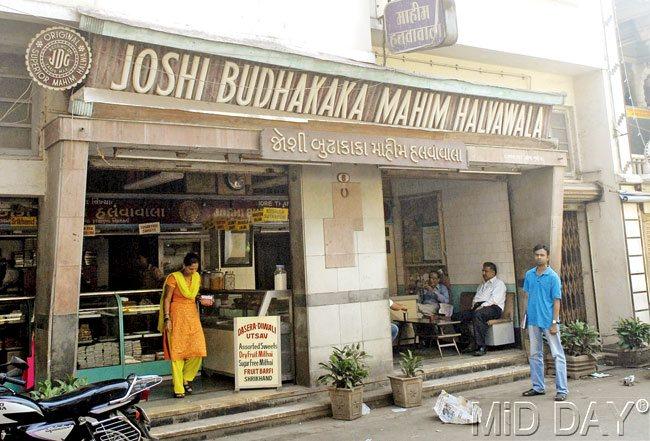 #12 Joshi Budhakaka, Sweet sheets of delight  There are several establishments in the city that are known for a particular dish they specialise in: Mawa cakes from Merwan, Falooda from Badshah or Chole Samose from Gurukripa. An addition to this is a sweets store whose locality lends a name to the sweet it specialises in, which is, Mahim Halwa from Joshi Budhakaka. The store opened more than 200 years ago. It gets its name from its founder, Girdhar Mauji, who came to the city from Jamnagar, and would sell halwa door to door. Children in the locality would call him, u201cbudha kakau201d, and thatu2019s how the name has stuck. The Mahim Halwa is a thin sheet made from clarified butter, sugar and wheat extract that is stretched out on planks of wood to make it as thin as possible. These sheets, that originally have the flavour of saffron but are available in various flavours today are then dusted with dryfruits. One can also buy farsan such as gaanthia and sev here. From the variety of sweets available at their stores, their barfis are worth a try too.  At: Dadar, Mahim and Tardeo. Call: 24449457  u2014 Dhara Vora