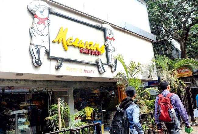 #35 Merwan's Action stations at Merwan's  When the commute seems overwhelming, take a break  A different outpost of the same name, this Merwan's in the Western suburb of Andheri is a distinct departure from the popular Irani establishment, B Merwan & Co. For station goers, Merwan's has doubled its presence by opening two spaces adjacent to each other. The place is always teeming, as the bakery offers a host of cocktail pizzas, rolls, biscuits, khari biscuits, cakes and much more. Youngsters to families, salivate at the refrigerated items that contain dollops of cream, on the sweets and value for money savouries. The brightly lit yellow and red sign and the warmly lit cake shop also lets customers sit casually, to catch up for a quick chat between hauls. Also, the cake shop holds great nostalgic value as its cakes are part of birthday and anniversary celebrations in several households. Loyalists vouch for the signature Butterscotch Cake and Lemon Crackle. From Shrewsbury biscuits to all sorts of rolls, the bakery hums with fresh stock from time to time, and exhausts its stocks quickly. Do try their Chicken Mayo Roll, Tandoori Paneer Roll, Mini Pizza, smoothies and more.  At: 12/13, Madhav Nagar, SV Road, Andheri (W). Call: 26244896  u2014 Kanika Sharma