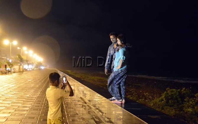 Monsoon is undoubtedly a time to get romantic, and Mumbai couples always enjoy the rains. Here a couple strike a pose during a rainy evening at Marine Drive. Pic/Sneha Kharabe
