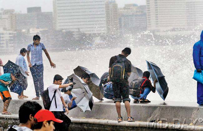 Marine Drive is the go-to spot for people to experience the true force of the sea. With the sea in full spate, gusty winds and rain lashing the city, the experience can be exhilarating. It sure looks like these boys are enjoying their free nature-fuelled ride. Pic/Sameer Abedi