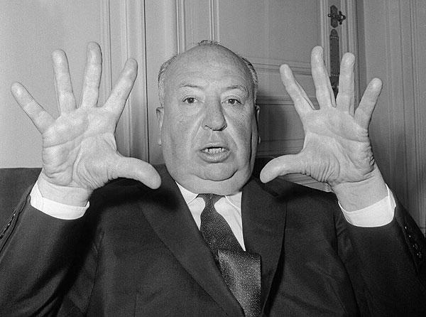 British film director Alfred Hitchcock (1899-1980) gestures as he gives a press conference in Paris to present his last movie 'Psycho' October 18, 1960