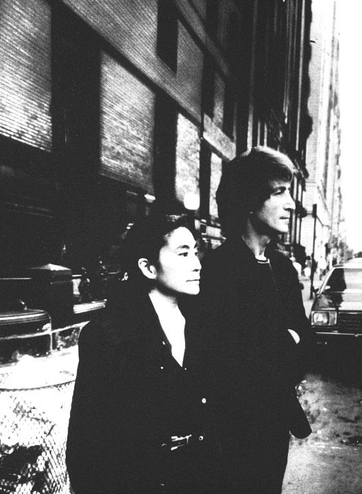 Photo taken during the summer of 1980 of English singer John Lennon standing with his wife Yoko Ono outside the Dakota Apartments in New York city, where he was shot to death on November 12, 1980. This photo appears on Lennon's last album 'Double Fantasy'