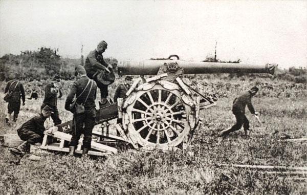 A picture of a post card released by the Historial de Pu00c3u0083u00c2u00a9ronne, Museum of WW1, shows French artillery soldiers with a '155 mm Rimailho' cannon during the First World War
