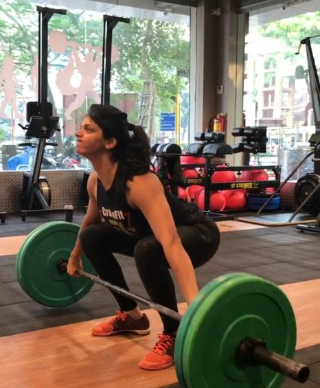 Neha has managed to build great muscle strength with her training. She is seen here lifting 55 kilograms of weight