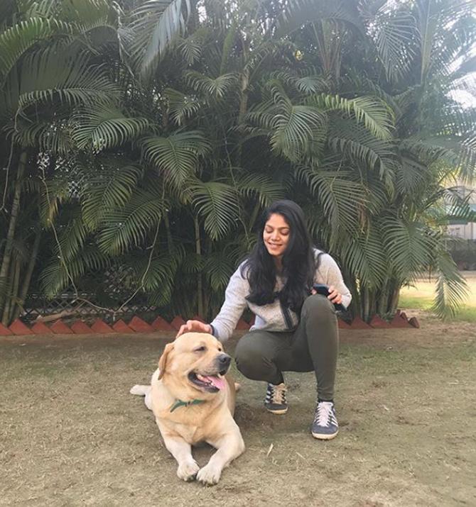 Neha Agarwalla is also fond of animals She is seen here with her four