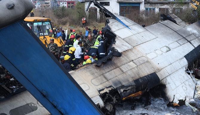 At least 40 people were killed and 23 injured when a Bangladeshi plane crashed and burst into flames near Kathmandu airport in Nepal on March 12, 2018. Pic/AFP 