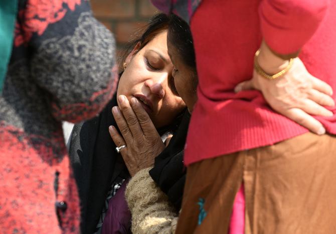 Family members of the plane crash victims outside a morgue at the Teaching Hospital in Kathmandu on March 13, 2018, a day after the deadly crash of a US-Bangla Airlines plane at the international airport. Pic/AFP