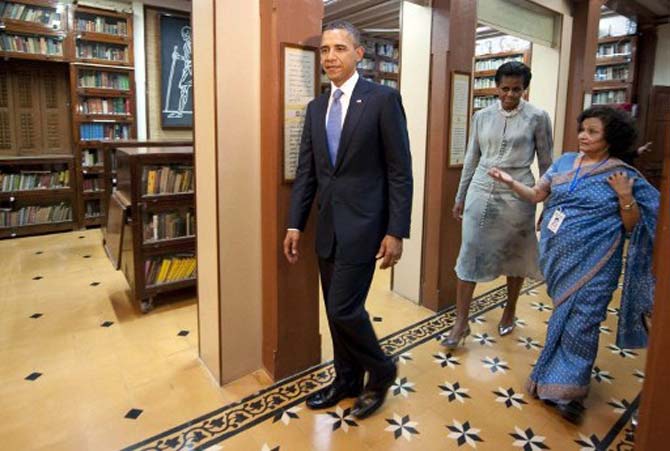 US President Barack Obama (L) and First Lady Michelle Obama (C) tour through the Mani Bhavan Gandhi Museum in Mumbai. Pic/AFP