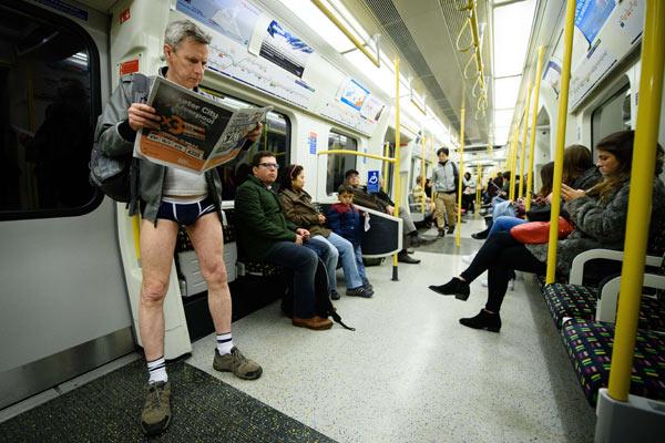 Participants in the annual International 'No Pants Subway Ride' travel on a London underground train in London, on January 10, 2016