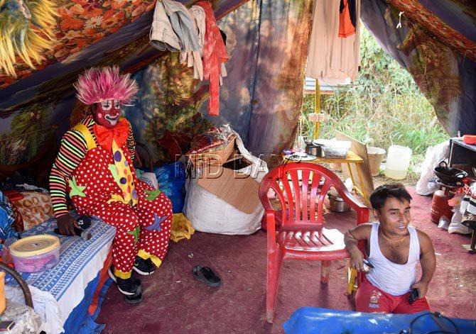 A clown at the Rambo Circus is all smiles as he takes a break backstage