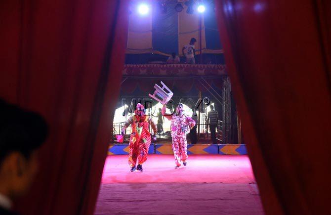 Clowns practice their routines before the opening of their show at Rambi Circus