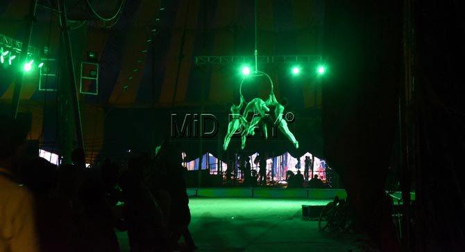 Gymnasts and contortion artists practice just before the opening of the show at Rambo Circus