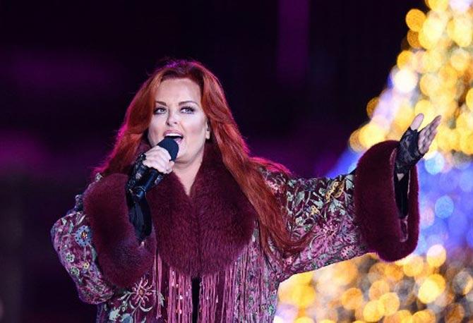 Wynonna Judd performs during the 95th annual National Christmas Tree Lighting ceremony at the Ellipse in President's Park near the White House in Washington, DC