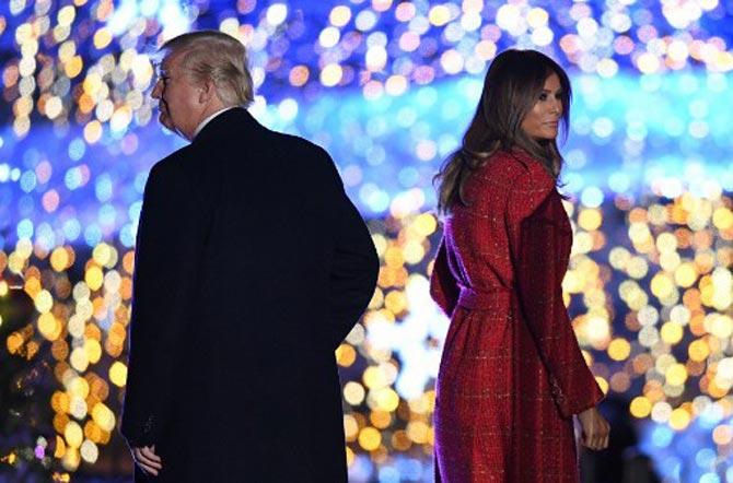 Donald Trump and First Lady Melania Trump walk on the stage during the ceremony