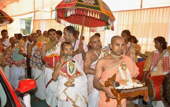 Devotees carry idols of Lord Krishna during a ceremony organized by Hare Krishna Movement to celebrate Sri Krishna Janmastami in Guwahati. Pic/PTI