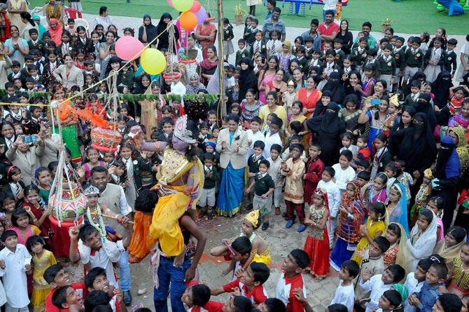 School children forming a pyramid to break Dahi Handi on the occasion Krishna Janamashtami in Chikmagalur, Karnataka on Thursday. Pic/PTI